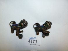 A pair of small contemporary oriental cloisonne and mesh Dogs of fo with moving heads.