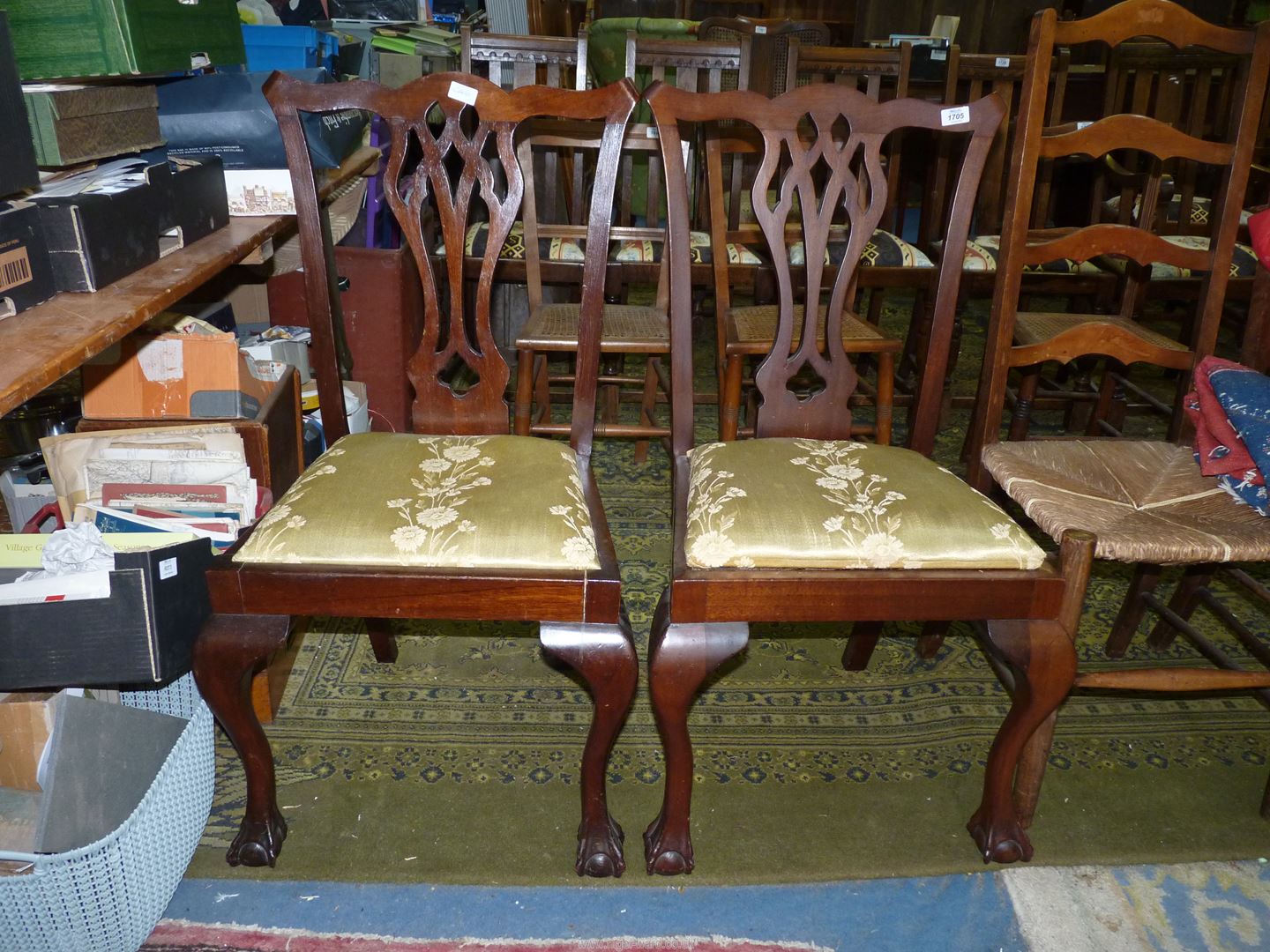 A pair of Mahogany Georgian design side Chairs having drop-in floral seat pads and standing on