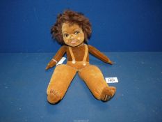 A 1930's Norah Wellings ZuZu South Islander Doll, label to left foot, 13" tall.