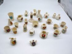 A quantity of crested souvenir ware including jugs and vases by Carlton, Arcadia, Foley, etc.