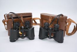 Two pairs of 8 x 30 Binoculars both in brown leather cases: Dolland and Olympian Super.