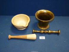 Two Pestles and Mortars, one brass, the other ceramic.