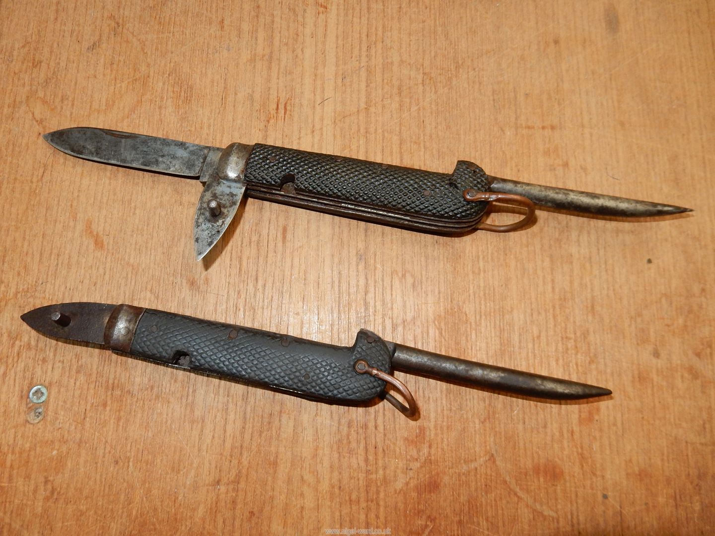 A cavalry type Knife having chequered handle, hoof-pick,