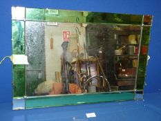 A vintage rectangular Mirror with green and clear baguette detail, 24'' x 16''.