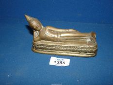 An old Chinese brass figure of a sleeping Buddha, 6" long x 3" tall.