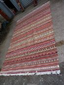 A Kilim style rug, striped and multi-coloured, 9' 7" x 6' 7".