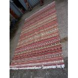 A Kilim style rug, striped and multi-coloured, 9' 7" x 6' 7".