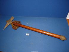A heavy cast War hammer or tribal ceremonial weapon with decorated head, 30" long.