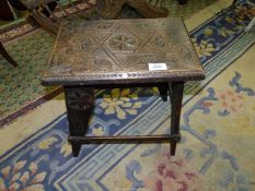 A carved Stool believed to be P.O.