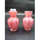A pair of late Victorian continental glass vases of footed and lobed form with a waisted collar