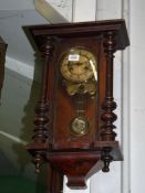 A Vienna style Wall Clock having a two train spring driven movement striking on a gong,