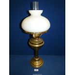 A Victorian brass oil Lamp with white shade and clear chimney, 24" tall.