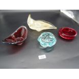 A group of three Czech and one Murano glass bowls including red gondola shape with thick clear