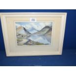 A framed and mounted Watercolour depicting a Loch scene with rugged mountains in the distance,