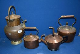 Three Copper teapots in various sizes and a copper lidded pouring Vessel.