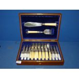 A boxed set including fish eaters and servers with bone handles and six fruit knives and forks with