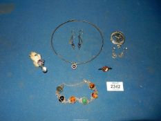 A small quantity of jewellery including silver necklace and earrings set with 'evil eye',