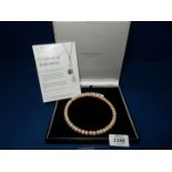 A genuine pearl choker from 'The Pearl Company', boxed.