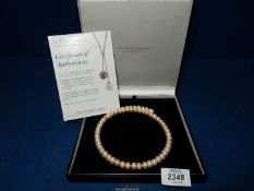 A genuine pearl choker from 'The Pearl Company', boxed.