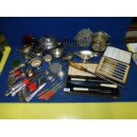 A quantity of plated items including cutlery, jugs, teapot etc.