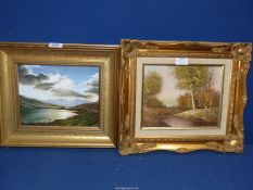 A small framed Oil on board depicting Loch scene with sun breaking through dark clouds and