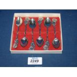 An interesting set of six good quality Danish silver tea spoons with flower and leaf terminals,