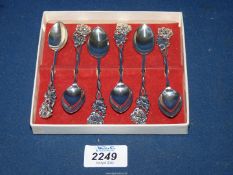 An interesting set of six good quality Danish silver tea spoons with flower and leaf terminals,