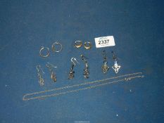 A small quantity of earrings, some silver and gold including a pair of 9ct gold Creole hoops,