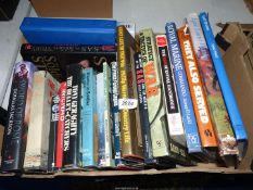 A box of military books including 'The Secret Raiders', 'Royal Marine Commando',