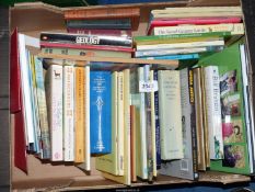 A box of books including geology, The Good Granny Guide, Fred Basset etc.
