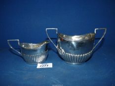 A Silver cream jug and matching two handled sugar basin, Birmingham 1901, maker IL, 162 gms total.