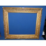 An antique ornate gilt frame, rebate 22 1/2" x 18 1/2".
