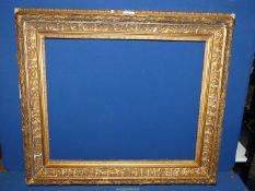 An antique ornate gilt frame, rebate 22 1/2" x 18 1/2".