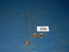 A 9ct gold necklace and stud earring set designed as a thistle, set with amethyst, 5.50g total.