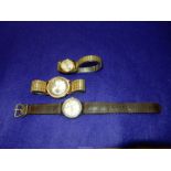 Three Timex crown wound Wristwatches including water resistant with beige face with Arabic numerals,