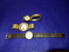 Three Timex crown wound Wristwatches including water resistant with beige face with Arabic numerals,