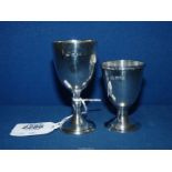 Two silver Egg Cups with London, 1932 and 1934, total weight 96.