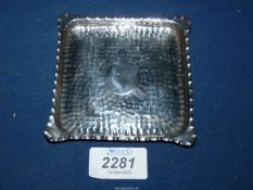 A Silver hammered effect square ashtray with pie crust edge, Birmingham,1886, 51.6 gms.