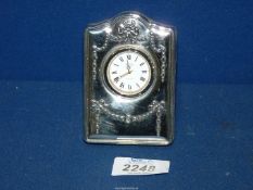 A Silver faced Easel Clock with raised swag decoration, Sheffield 1994, maker R.