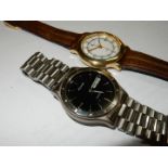An Accurist quartz day/date wristwatch having a black face with baton hour markers and a stainless
