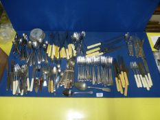 A large quantity of 1940's/1950's cutlery including knives and forks; bone handled,