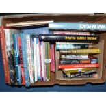A box of military books including 'Battlefield Detectives', 'Band of Brothers',