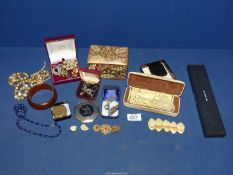 A quantity of costume jewellery including brooches, para shell pendant, necklaces,