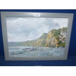 A framed Oil on canvas of a coastal scene with boats being winched ashore and houses on a steep