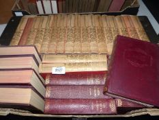 A box of books including Charles Dickens and William Shakespeare.