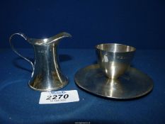 A James Dixon & Sons Sheffield Silver egg cup 1943, 74 gms, plus a miniature Silver jug,