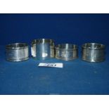 Four silver Napkin Rings including a pair, another engraved and a a wide one, Birmingham 1908,