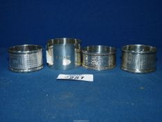 Four silver Napkin Rings including a pair, another engraved and a a wide one, Birmingham 1908,