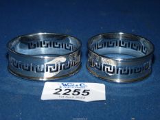 A boxed pair of H.M. silver Birmingham 1928 napkin rings, 20 gms.