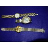 A John Paul Suchel quartz Wristwatch with pale gold coloured face having baton markers and